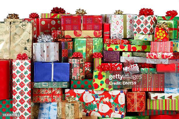 stack of christmas presents - pile of gifts stock pictures, royalty-free photos & images