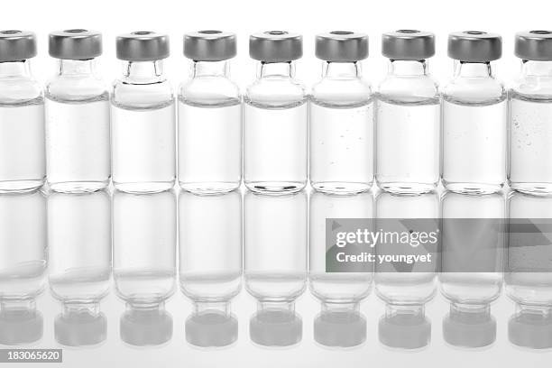 row of vials with medicine - medicinflaska bildbanksfoton och bilder