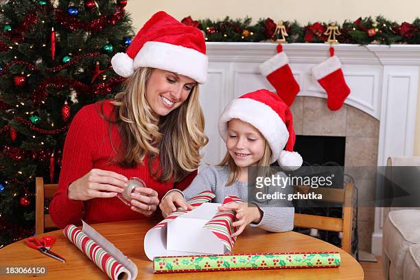 wrapping christmas gifts - gchutka stock pictures, royalty-free photos & images