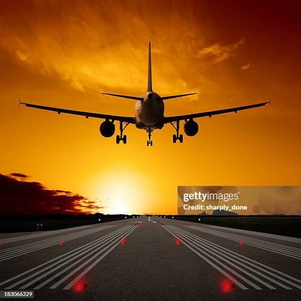 xl jet airplane landing at sunset - aircraft tarmac stock pictures, royalty-free photos & images