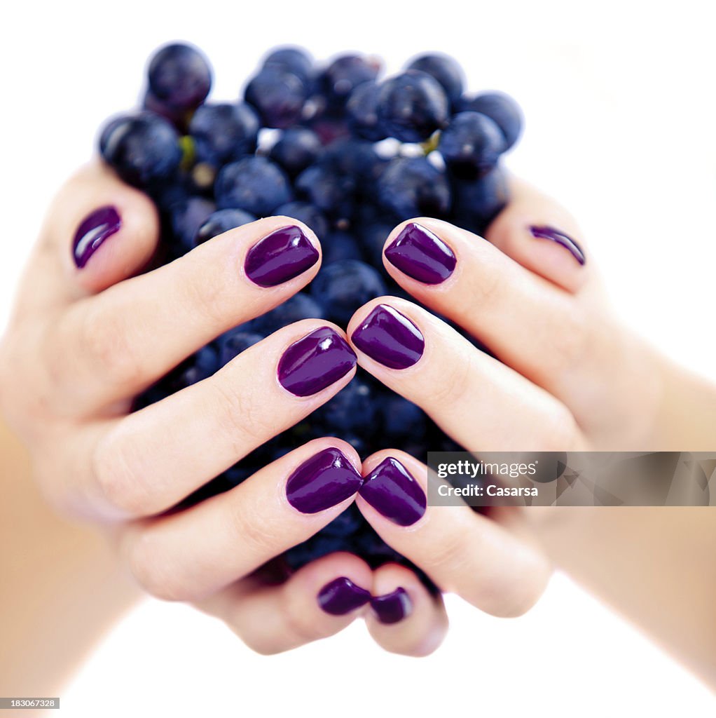 Woman holding grapes
