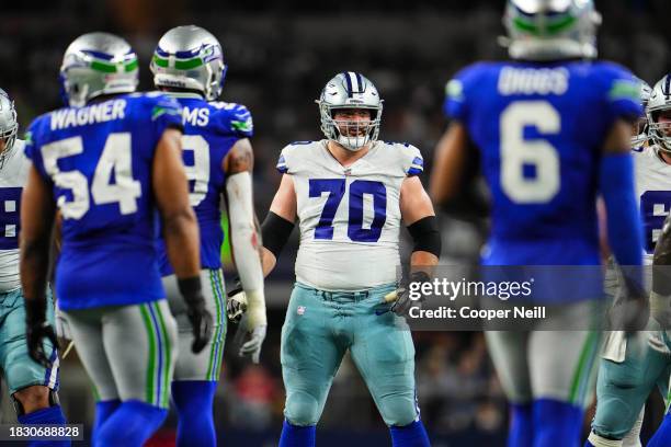 Zack Martin of the Dallas Cowboys looks on from the field during an NFL football game against the Seattle Seahawks at AT&T Stadium on November 30,...