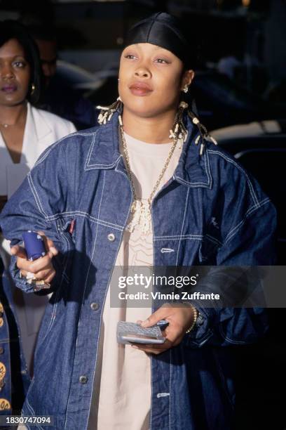 American rapper Da Brat, wearing a denim jacket and a black bandana, attends the Hollywood premiere of 'Big Momma's House', held at Cinerama Dome in...