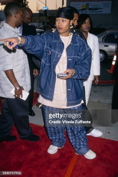 American rapper Da Brat, wearing a denim jacket and a black bandana, attends the Hollywood premiere of 'Big Momma's House', held at Cinerama Dome in...