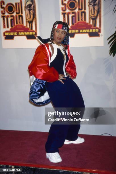 American rapper Da Brat, wearing a red, white and blue jacket and matching headband with blue Enhale trousers, in the press room of the 11th Soul...