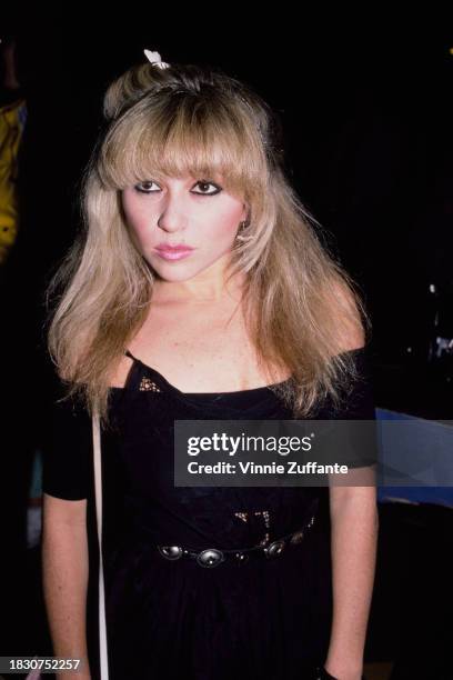 American actress and singer EG Daily attends the 'Top Gun' afterparty at Cafe America in New York City, New York, 12th May 1986. The afterparty...