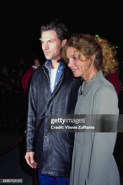 American actor Tim Daly, wearing a black leather jacket, and his wife, American actress Amy Van Nostrand, who wears a black-and-white fine check...