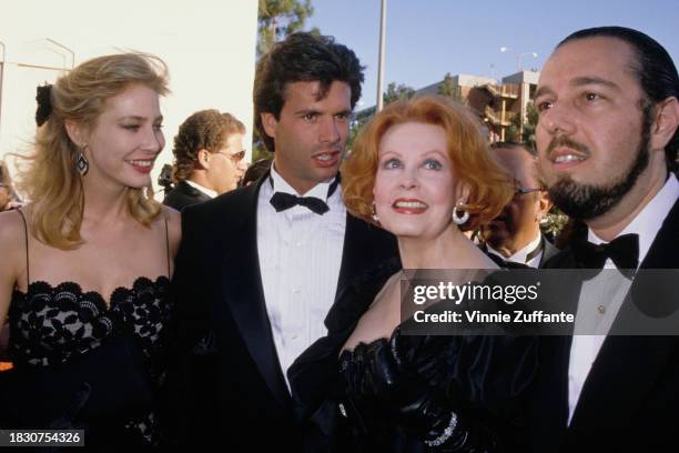 American actress Kathleen Kinmont and her husband, American actor Lorenzo Lamas, with his Lamas's mother, American actress Arlene Dahl and her...