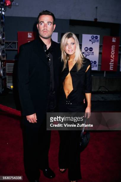 American television presenter Carson Daly and American actress Tara Reid attend the 2000 MTV Movie Awards, held at Sony Pictures Studios in Culver...