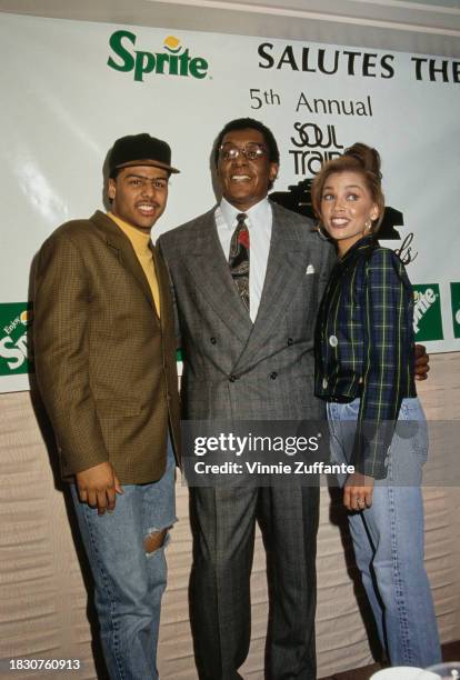 American singer-songwriter Al B Sure!, wearing a tweed jacket over a yellow crew neck shirt and a baseball cap, American television show host Don...