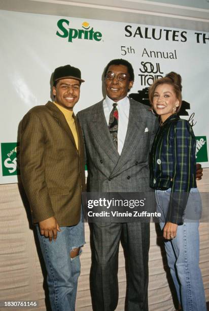 American singer-songwriter Al B Sure!, wearing a tweed jacket over a yellow crew neck shirt and a baseball cap, American television show host Don...