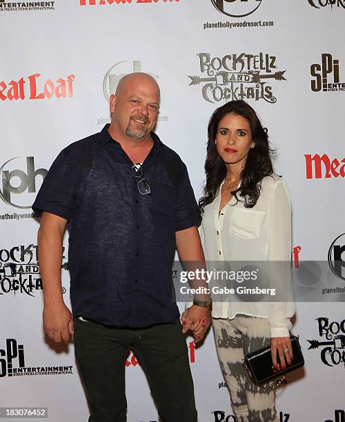 Television personality Rick Harrison and his wife, Deanna Burditt arrive at the show "RockTellz & CockTails presents Meat Loaf" at Planet Hollywood...