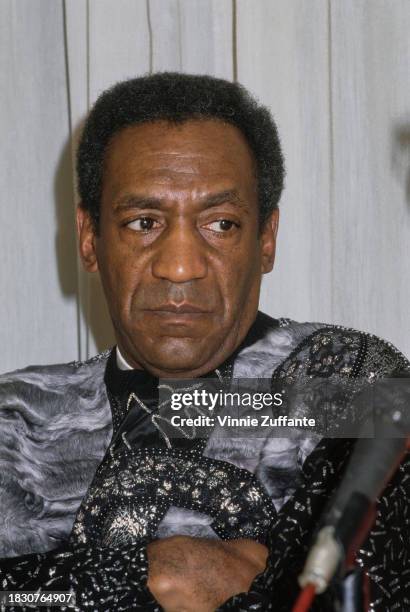 American actor and comedian Bill Cosby wearing a grey patterned sweater, at a press conference to announce a joint venture with the Dance Theatre of...