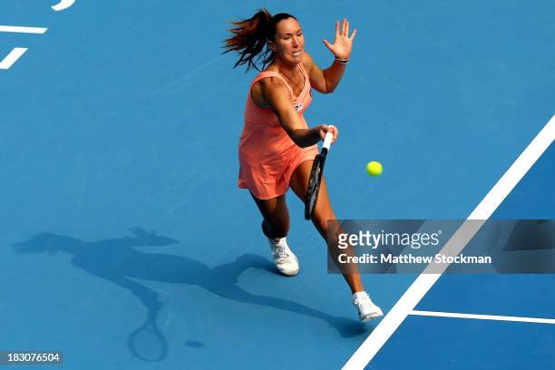 Jelena Jankovic of Serbia lunges for a shot while playing Lucie Safarova of Czech Republic during day seven of the 2013 China Open at the National...
