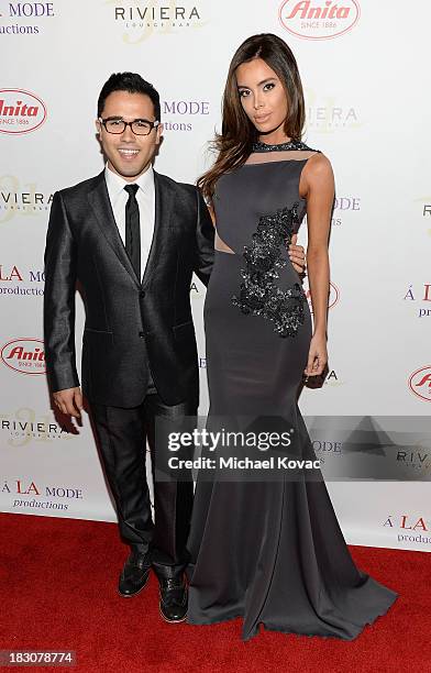 Designer Walter Mendez and model Sarah Stage arrive for A la mode Productions Presents Designers Night Out at Sofitel Hotel on October 3, 2013 in Los...