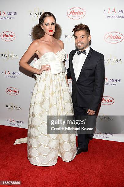 Designer Uriel Saenz and muse Courtney Dickson arrive for A la mode Productions Presents Designers Night Out at Sofitel Hotel on October 3, 2013 in...