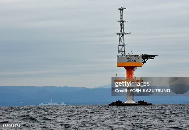 An electric substation stands positioned in the sea off the coast of Naraha town in Fukushima prefecture on October 4 as Tokyo Electric Power's...