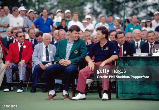 The new Masters Champion, Ian Woosnam of Great Britain and last year's winner Nick Faldo of Great Britain, chatting during the presentation ceremony...