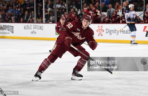 Logan Cooley of the Arizona Coyotes skates up ice against the St Louis Blues at Mullett Arena on December 02, 2023 in Tempe, Arizona.