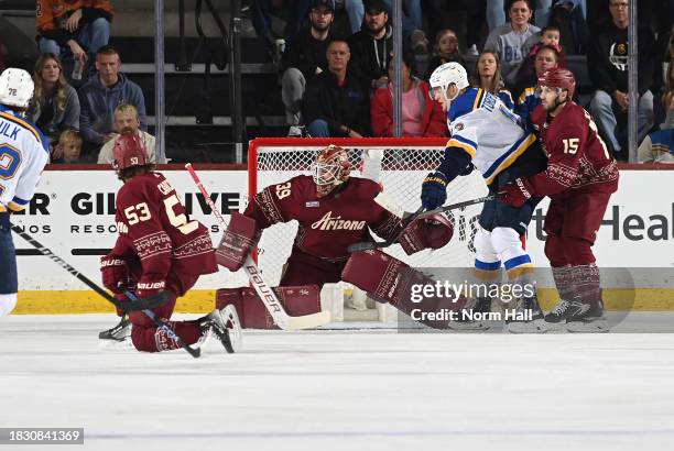 Connor Ingram of the Arizona Coyotes makes a save against the St Louis Blues at Mullett Arena on December 02, 2023 in Tempe, Arizona.