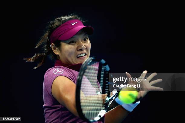 Li Na of China returns a shot during her women's singles match against Petra Kvitova of Czech Republic on day seven of the 2013 China Open at the...