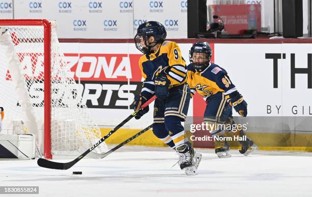 Members of the Arizona Bobcats 8U Mites team skate during the first intermission of the game between the Arizona Coyotes and the St Louis Blues at...