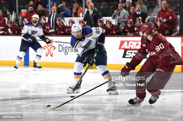 Jordan Kyrou of the St Louis Blues skates with the puck against the Arizona Coyotes at Mullett Arena on December 02, 2023 in Tempe, Arizona.