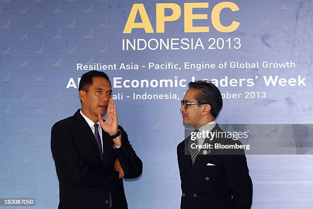 Gita Wirjawan, Indonesia's trade minister, left, speaks with Marty Natalegawa, Indonesia's foreign minister, ahead of the Asia-Pacific Economic...