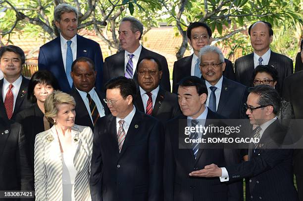 Secretary of State John Kerry ,Indonesian Foreign Minister Marty Natalegawa and Australian Foreign Minister Julie Bishop pose for a group picture...