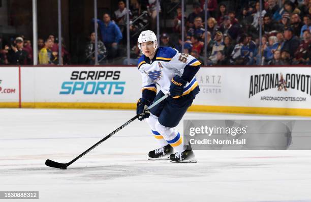 Colton Parayko of the St Louis Blues skates with the puck against the Arizona Coyotes at Mullett Arena on December 02, 2023 in Tempe, Arizona....