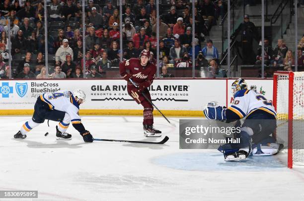 Logan Cooley of the Arizona Coyotes passes the puck against the St Louis Blues at Mullett Arena on December 02, 2023 in Tempe, Arizona.