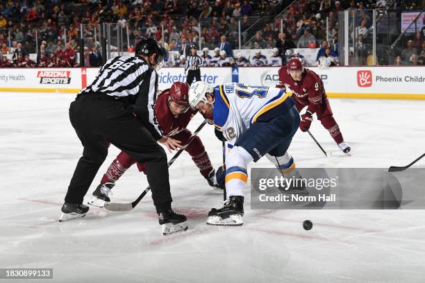 Kevin Hayes of the St Louis Blues wins a face off against the Arizona Coyotes at Mullett Arena on December 02, 2023 in Tempe, Arizona.