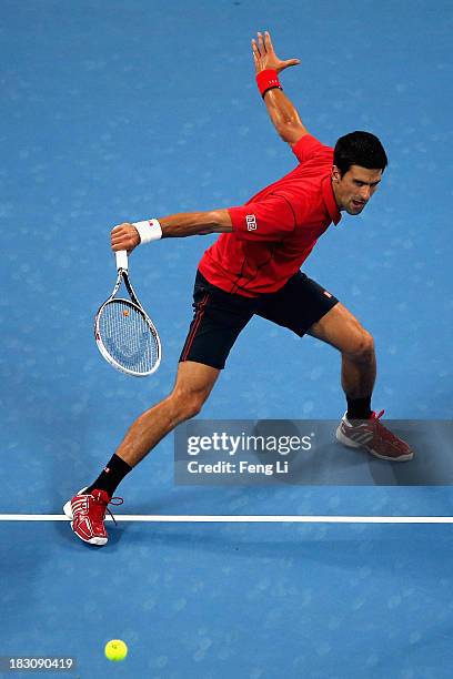 Novak Djokovic of Serbia returns a shot during his men's quarter-final match against Sam Querrey of United States on day seven of the 2013 China Open...