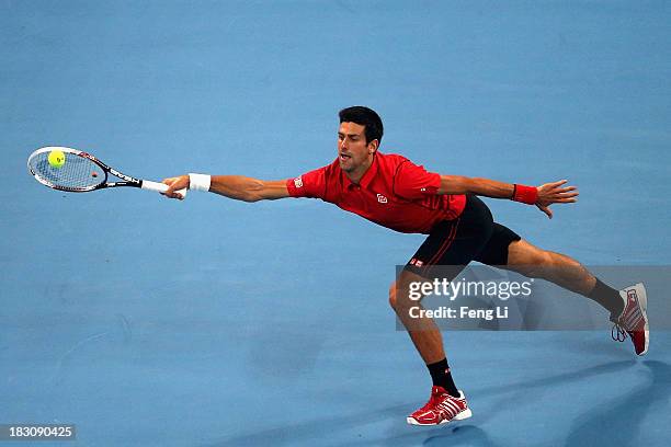 Novak Djokovic of Serbia returns a shot during his men's quarter-final match against Sam Querrey of United States on day seven of the 2013 China Open...