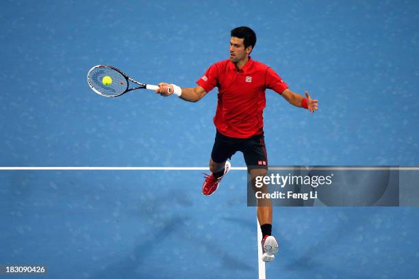 Novak Djokovic of Serbia returns a shot during his men's quarter-final match against Sam Querrey of United States on day seven of the 2013 China Open...