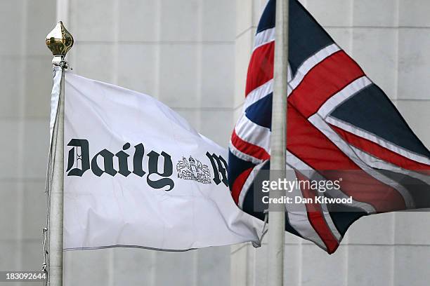 Union Jack flag flies beside a flag advertising the Daily Mail outside Northcliffe House, where the offices of British newspapers the Daily Mail and...
