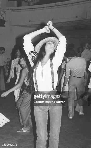 American singer and actress Cher dances at Studio 54, New York, New York, July 26, 1977.