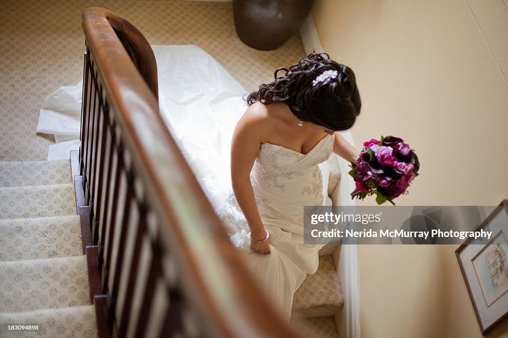 Bride walking down stairs