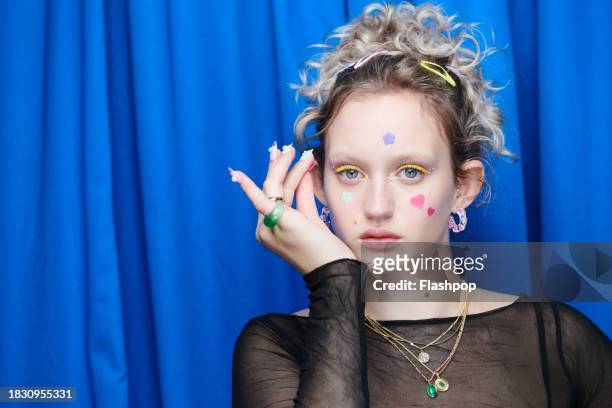 portrait of a young woman wearing pimple patches on her face. - a lot of stock pictures, royalty-free photos & images