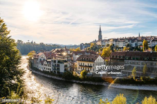 view of bern in autumn with its cathedral in distance - bern stock pictures, royalty-free photos & images