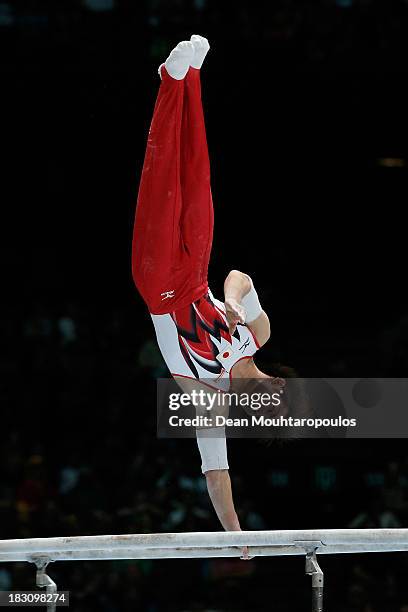 Ryohei Kato of Japan competes in the parallel bars during the Mens All-Around Final on Day Four of the Artistic Gymnastics World Championships...