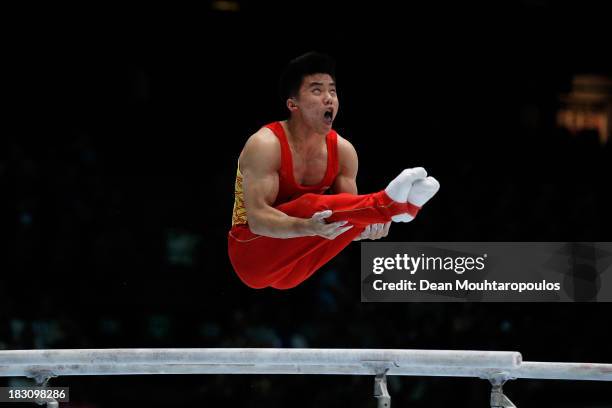 Chaopan Lin of China competes in the parallel bars during the Mens All-Around Final on Day Four of the Artistic Gymnastics World Championships...