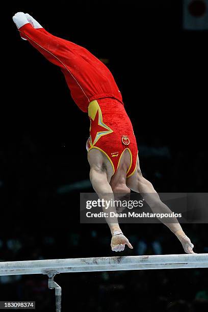 Shixiong Zhou of China competes in the parallel bars during the Mens All-Around Final on Day Four of the Artistic Gymnastics World Championships...