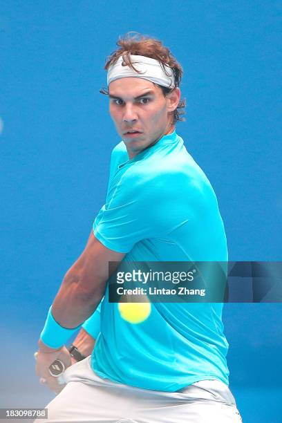 Rafael Nadal of Spain returns a shot to Fabio Fognini of Italy during day seven of the 2013 China Open at the National Tennis Center on October 4,...