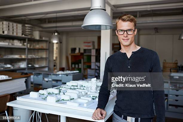 portrait of male architect w. model made of foam - male model casual imagens e fotografias de stock