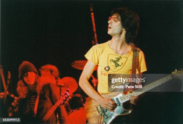 Guitarist Lenny Kaye performs on stage with Patti Smith in the background, at Wembley Arena, on September 5th, 1979 in London, England.