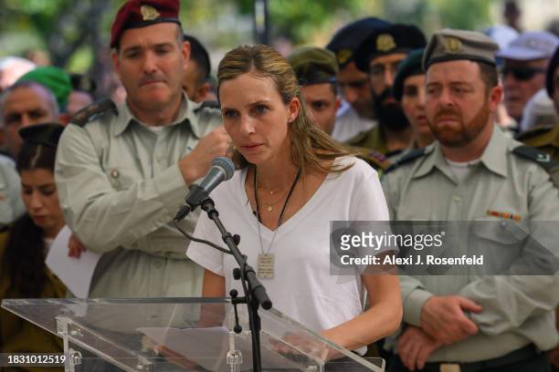 The wife of Col. Asaf Hamami, commander of Gaza Division's Southern Brigade, gives a eulogy during his funeral at the Kiryat Shaul cemetery on...