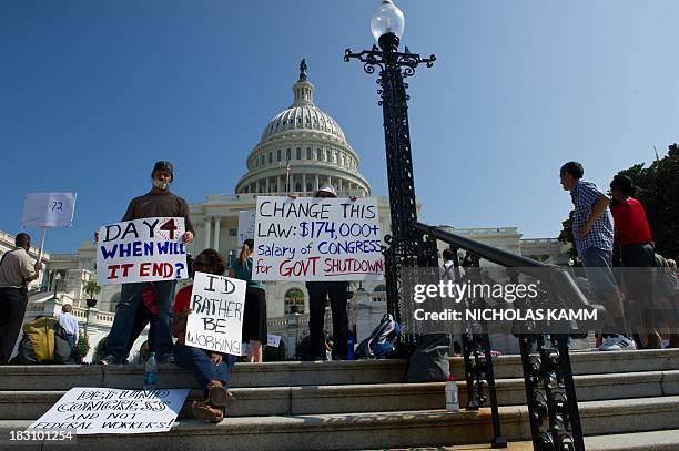 Federal workers demonstrate against the government shutdown in front of the US Capitol in Washington on October 4, 2013. The US government shut down...