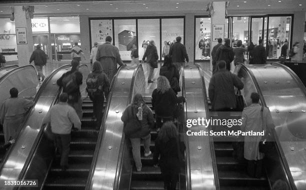 View of commuters on and near the escalators on the concourse at the World Trade Center, New York, New York, November 14, 2000.