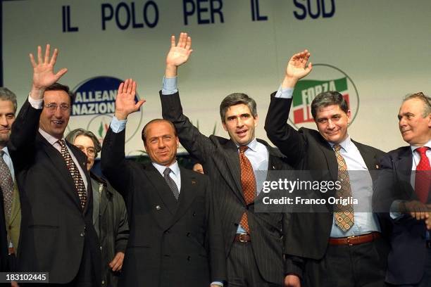 Gianfranco Fini, Silvio Berlusconi, Pier Ferdinando Casini, Rocco Buttiglione and Giuseppe 'Pinuccio' Tatarella attend a center-right coalition rally...